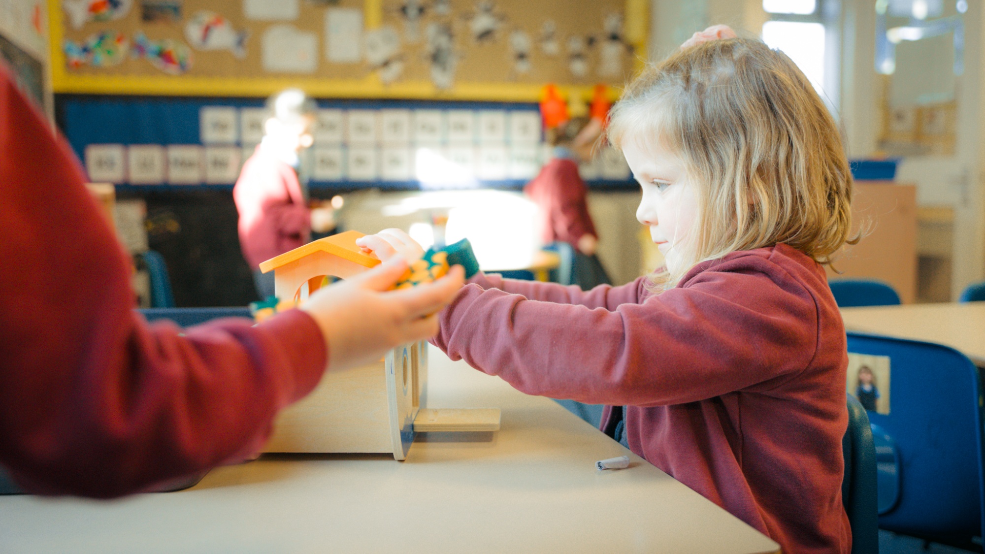 children playing in classroom