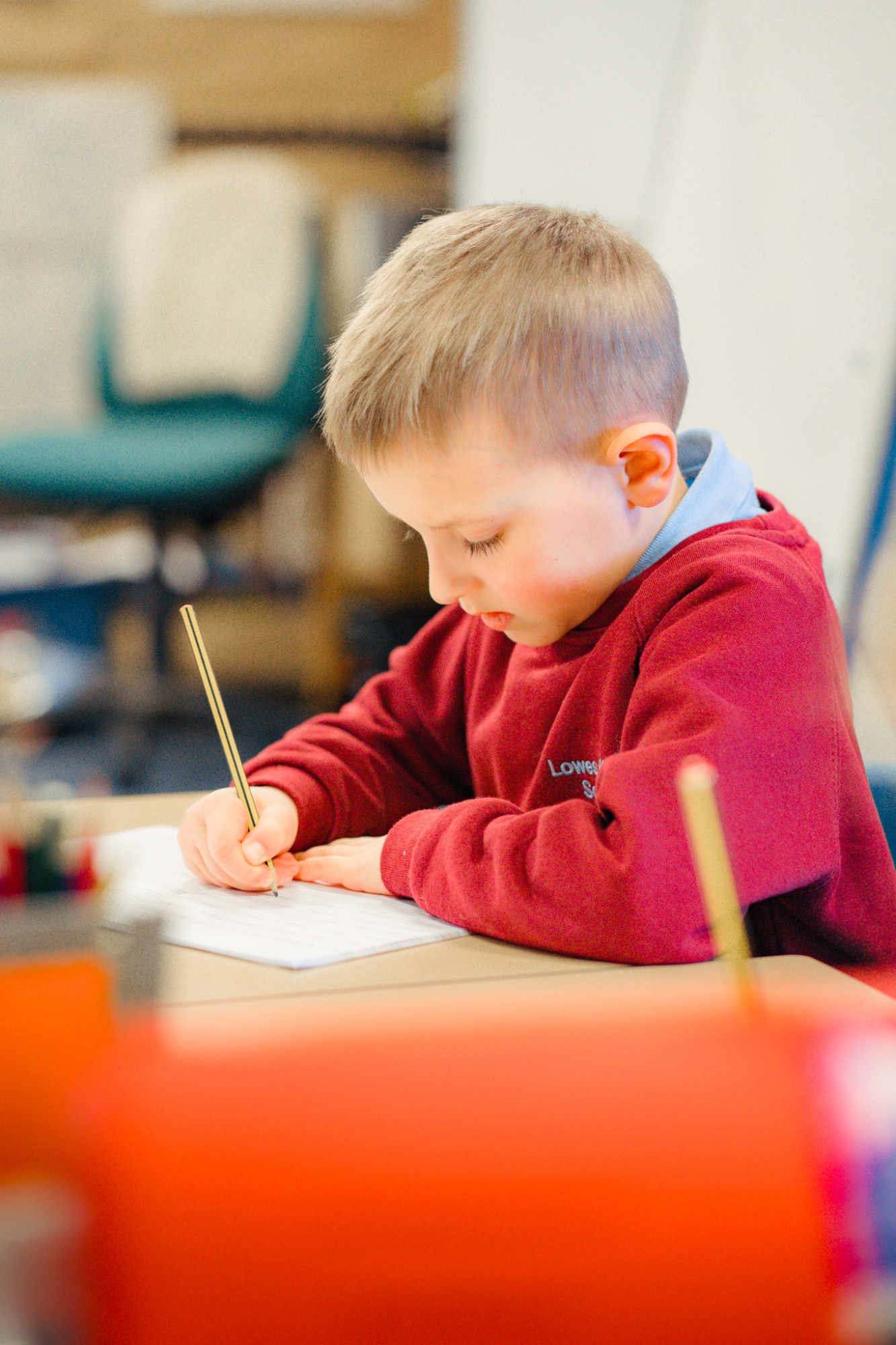 student writing in text book