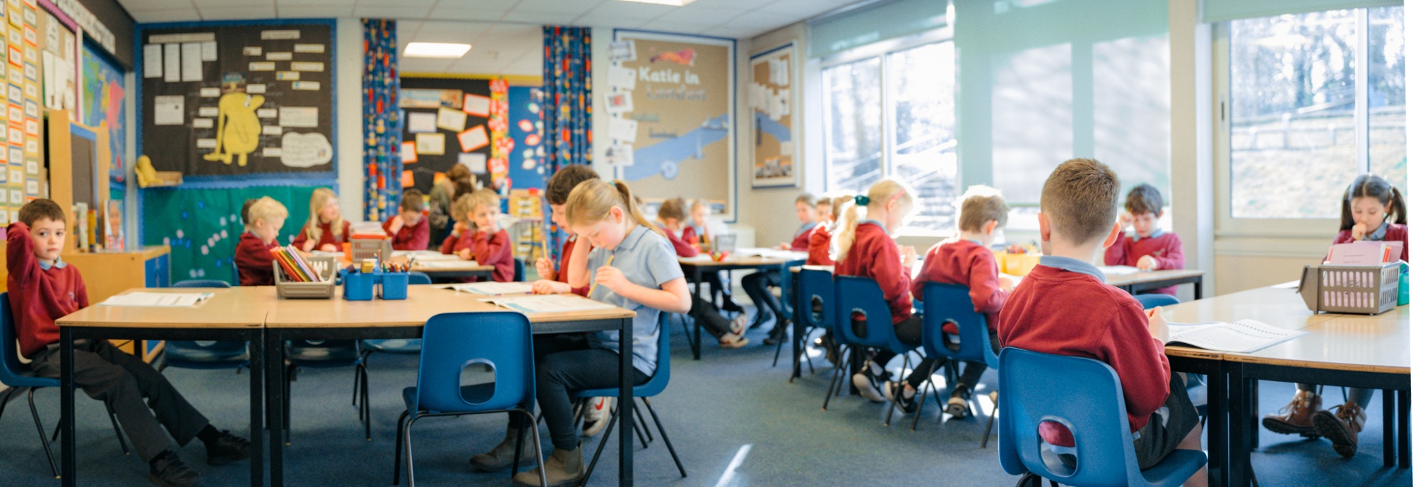 wide classroom photo. of students working