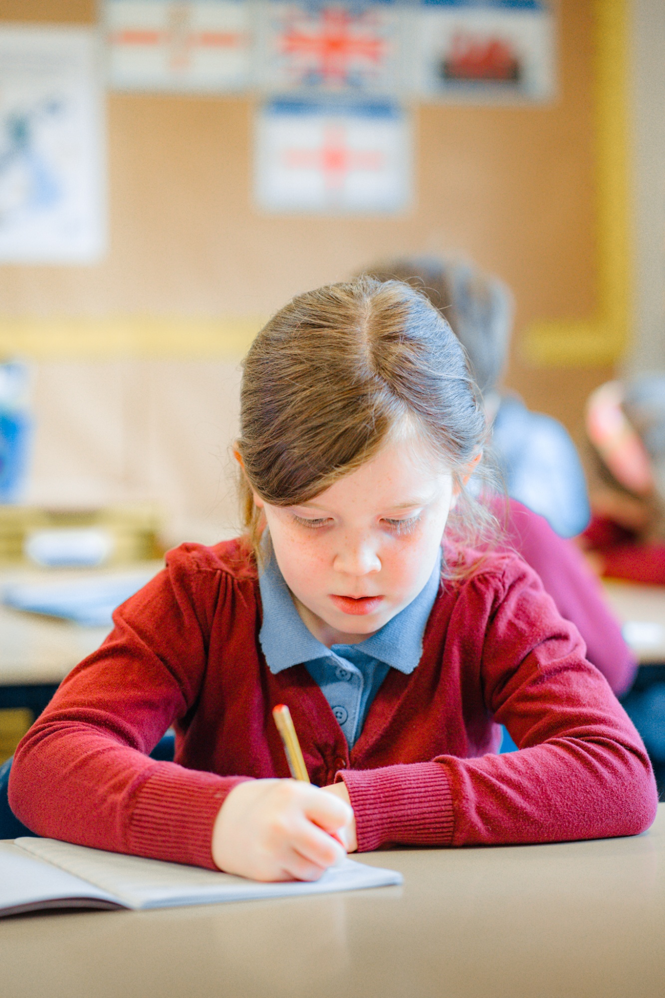 student writing in text book